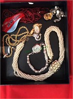 Costume jewelry including necklaces, earrings,