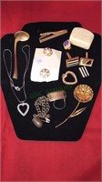 Group costume jewelry including a rhinestone