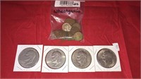 Four Eisenhower silver dollars, 25 wheat pennies