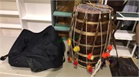 Tom-tom type drum with rustic drumsticks, leather