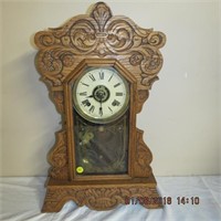 Gingerbread Insonia clock in carved oak case