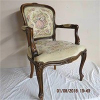 Carved French arm chair, tapestry upholstery