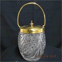 Pressed glass biscuit barrel,  brass rim and top