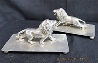 Pair of metal lion figures on footed 8 X 4" plate