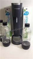 Soda Stream machine with three bottles and two