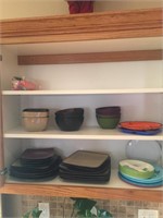 Contents of kitchen cupboard plates bowls