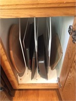 Contents of kitchen cupboard baking sheets