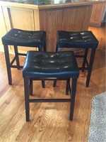 Three wooden barstools with leather seats approxi