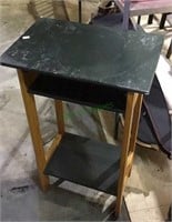 Green top side table with natural wood base, cut