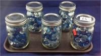 5 caning jars of glass beads