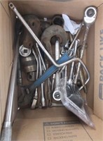 Assortment of ratchets, adjustable wrench, socket