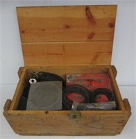 Wood ammo crate with electronic items.