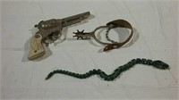 Spur, toy gun and snake