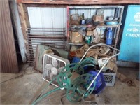 Group of items including barn fan, box fan, hose