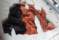(8) Pieces of tanned dark deer hide and a pair of