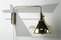 Brass tone wall mounted swivel lamp
