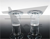 A pair of clear glass Blenko candleholders