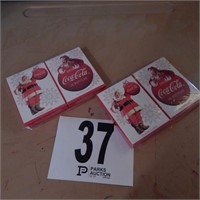 FOUR PACKS OF COCA COLA SANTA PLAYING CARDS