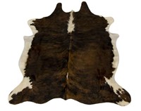 TANNED DARK BROWN, BLACK, AND WHITE COW HIDE