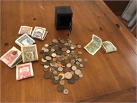 Mini metal bank with large lot of foreign money