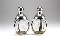 Two glass Haig's decanters with silver mounts