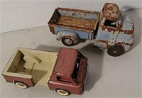 2 tin toy trucks