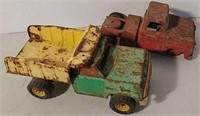 Two tin toy trucks