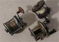 3 fishing reels- 2 Pflueger and 1 Penn