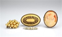 Four brooches including a cameo