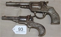 2 ornate iron cap guns, "SCOUT" Pat. June 17, 1880