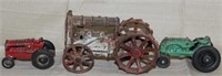3 cast iron tractors, Red signed "ARCADE" driver