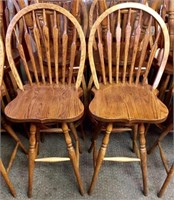 Pair of oak round back swivel bar stools