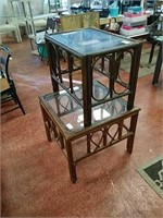 Two wooden side tables with glass