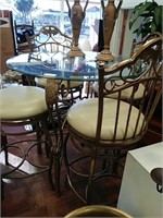 Glass top metal table with 4 chairs
