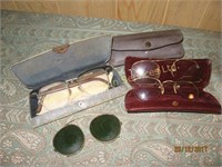 Three vintage reading glasses in cases two