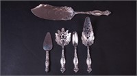 Five sterling silver servers including