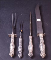 A four-piece sterling silver carving set