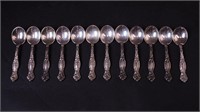 12 sterling silver egg spoons,