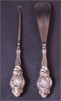 Two pieces marked sterling silver: a shoehorn and