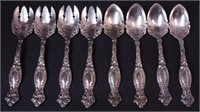 Eight pieces of sterling: four citrus spoons