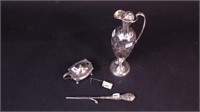 Four pieces of sterling silver holloware including