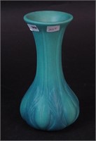 A turquoise 7" art pottery vase with leaf