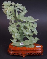 A 10" green Oriental-style stone carved figurine