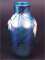 A 7 1/2" art glass vase with flowers signed