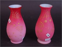 A pair of 7" pink cased vases decorated with