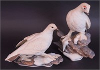 A pair of Boehm porcelain figurines,