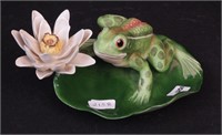 A figurine of frog on lily pad marked Boehm,