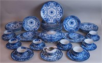 A 57-piece set of flow blue china dinnerware,