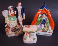 Three Straffordshire figurines including a double