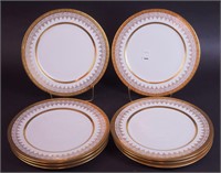 Eight 11" dinner plates with heavy gilding
